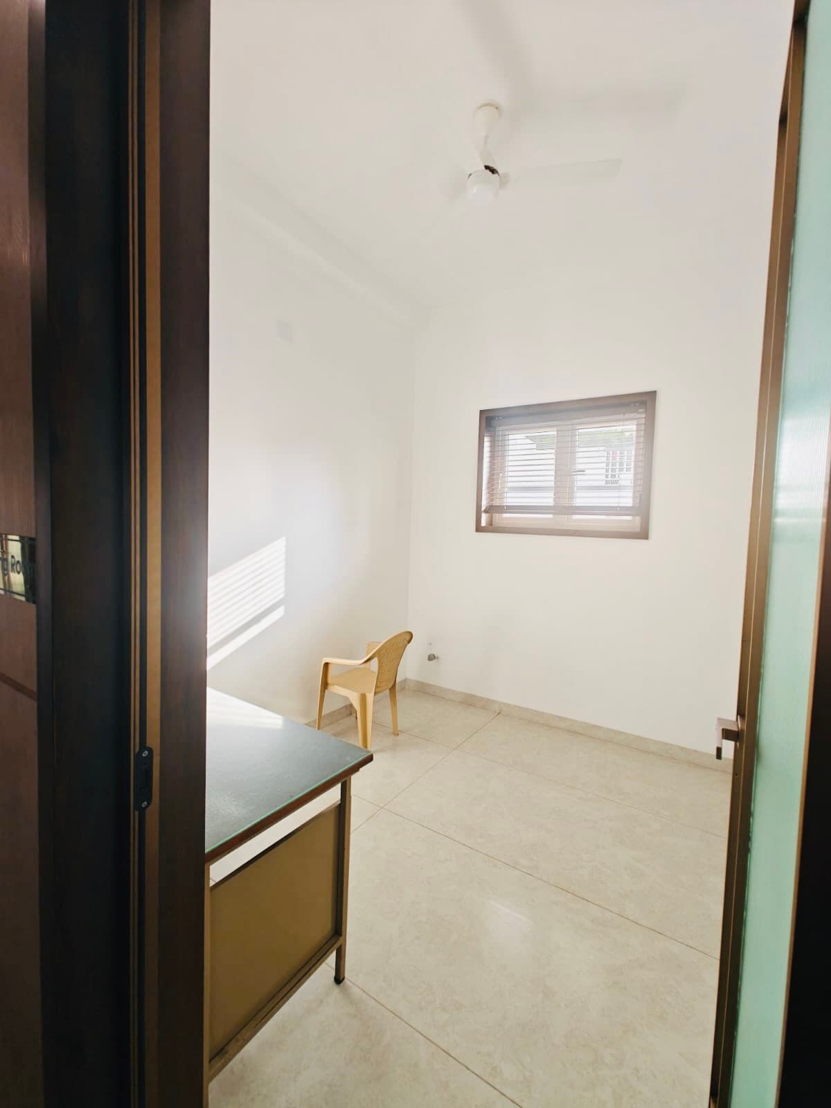The nursing room, quiet and bright, with a chair by the window